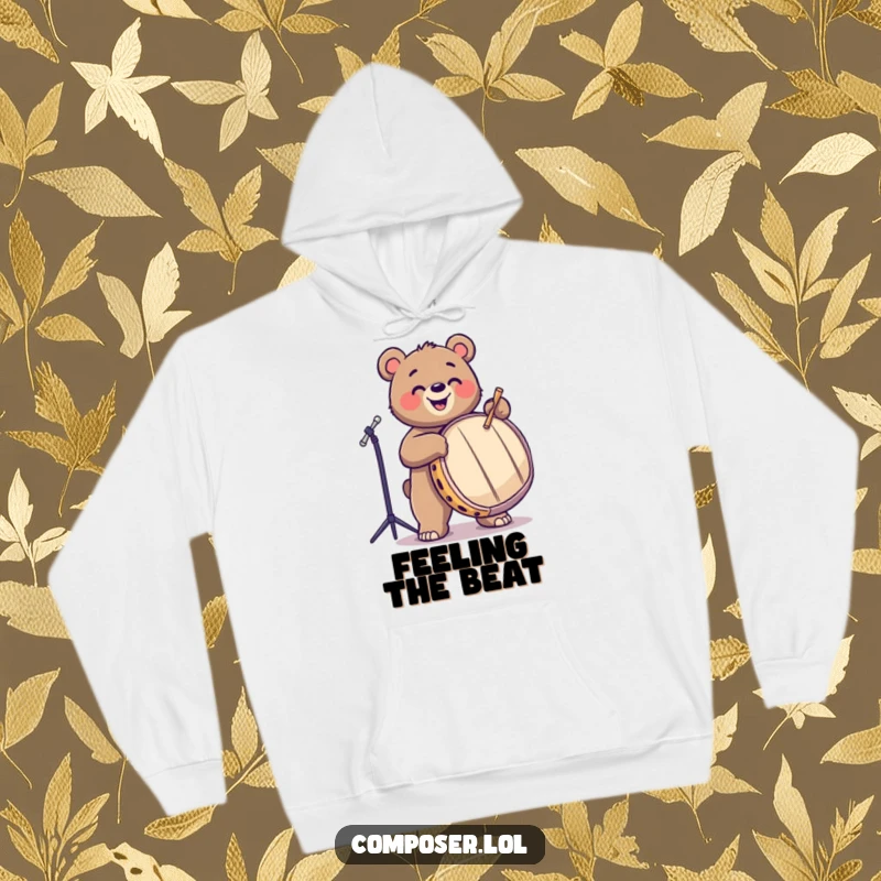 Funny, joyful bear drumming with enthusiasm on a large drum, featured on a warm hoodie. Perfect for music lovers.