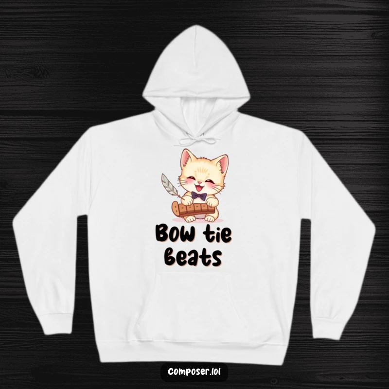 Funny hoodie with a dapper kitten in a bow tie playing a xylophone with a feather, offering cozy warmth and musical merriment.